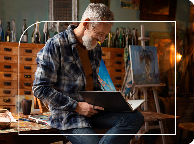 Independent Artist looking at his work